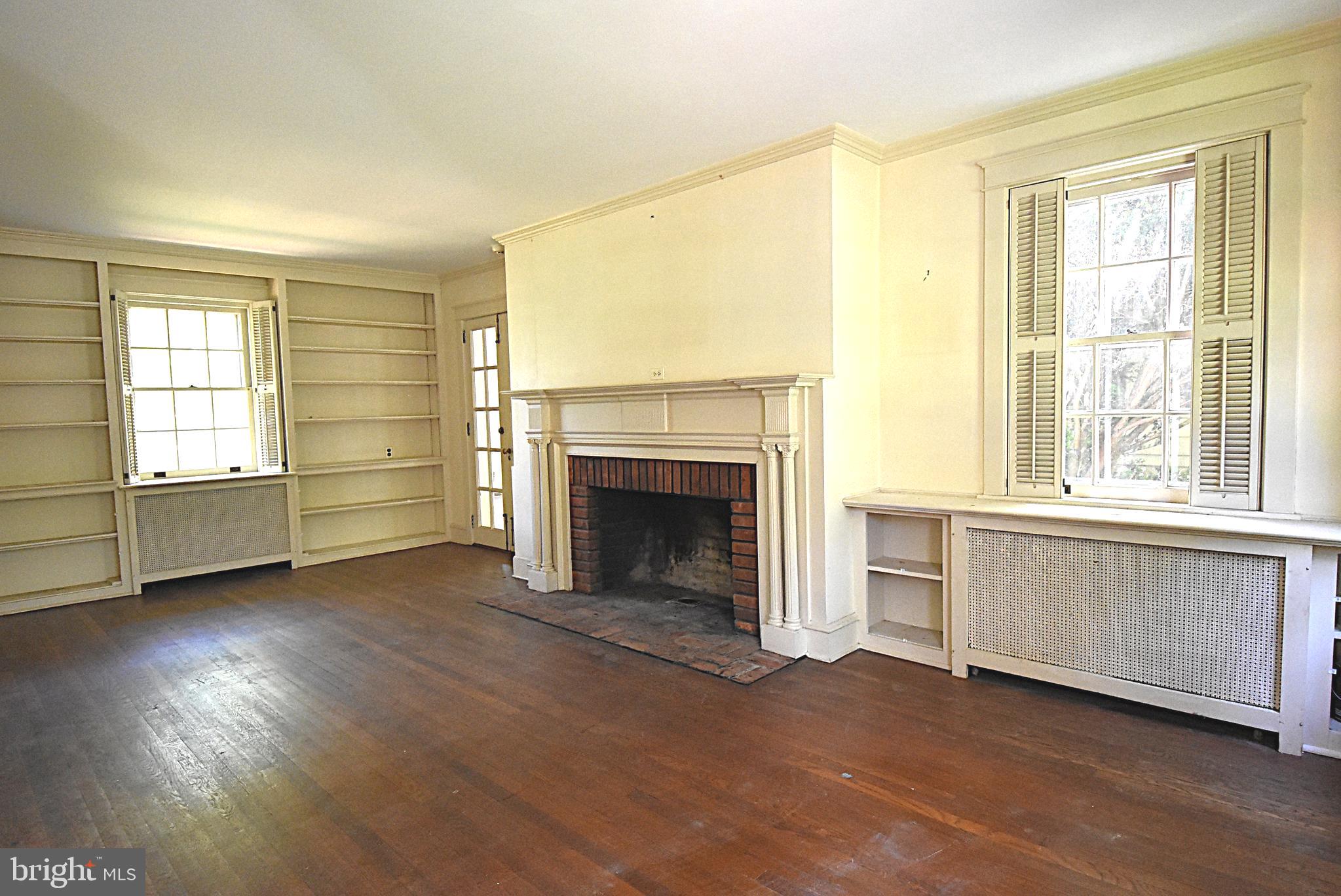19 Farm Road Wayne, PA 19087 - Photo 10 of 41 an empty room with windows and a fireplace