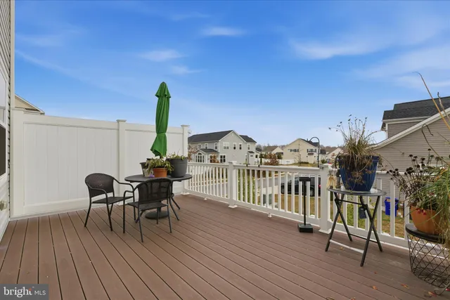 a view of a balcony with furniture