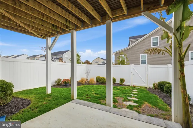 a bedroom with a bed table and a window