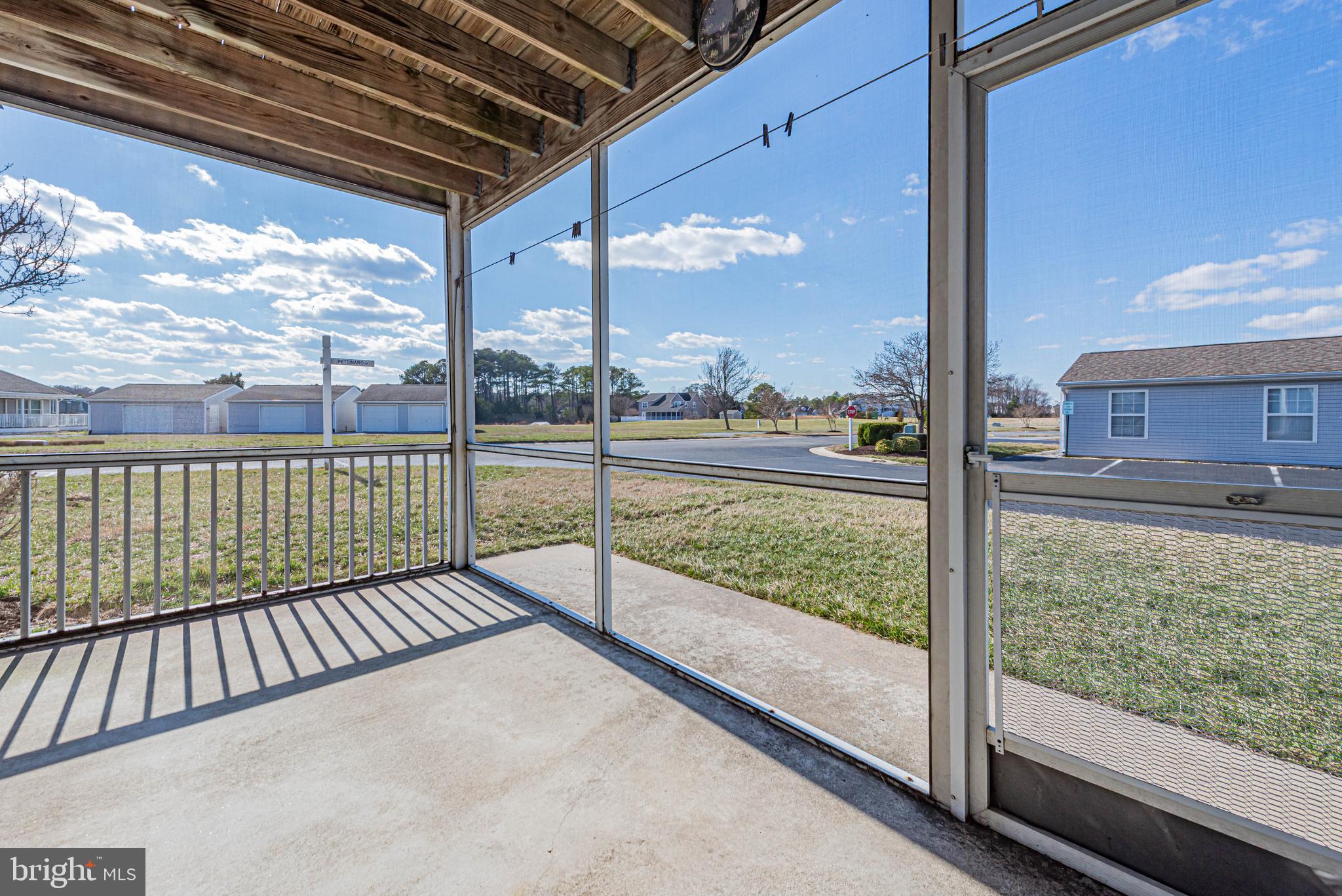 30381 Crowley Drive, Unit 313 Ocean View, DE 19970 - Photo 22 of 47 a view of a porch with a yard
