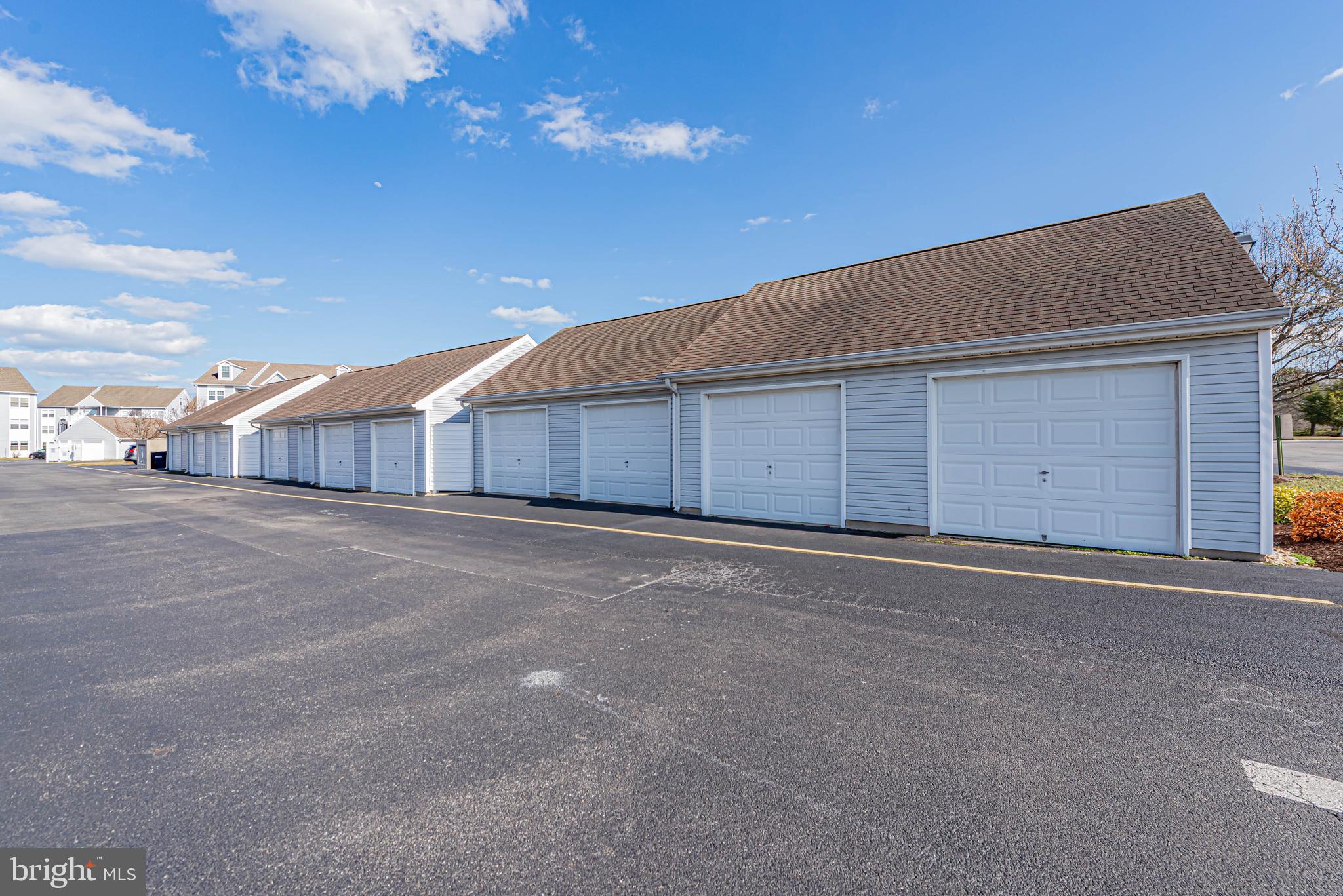 30381 Crowley Drive, Unit 313 Ocean View, DE 19970 - Photo 25 of 47 a house with yard in front of it