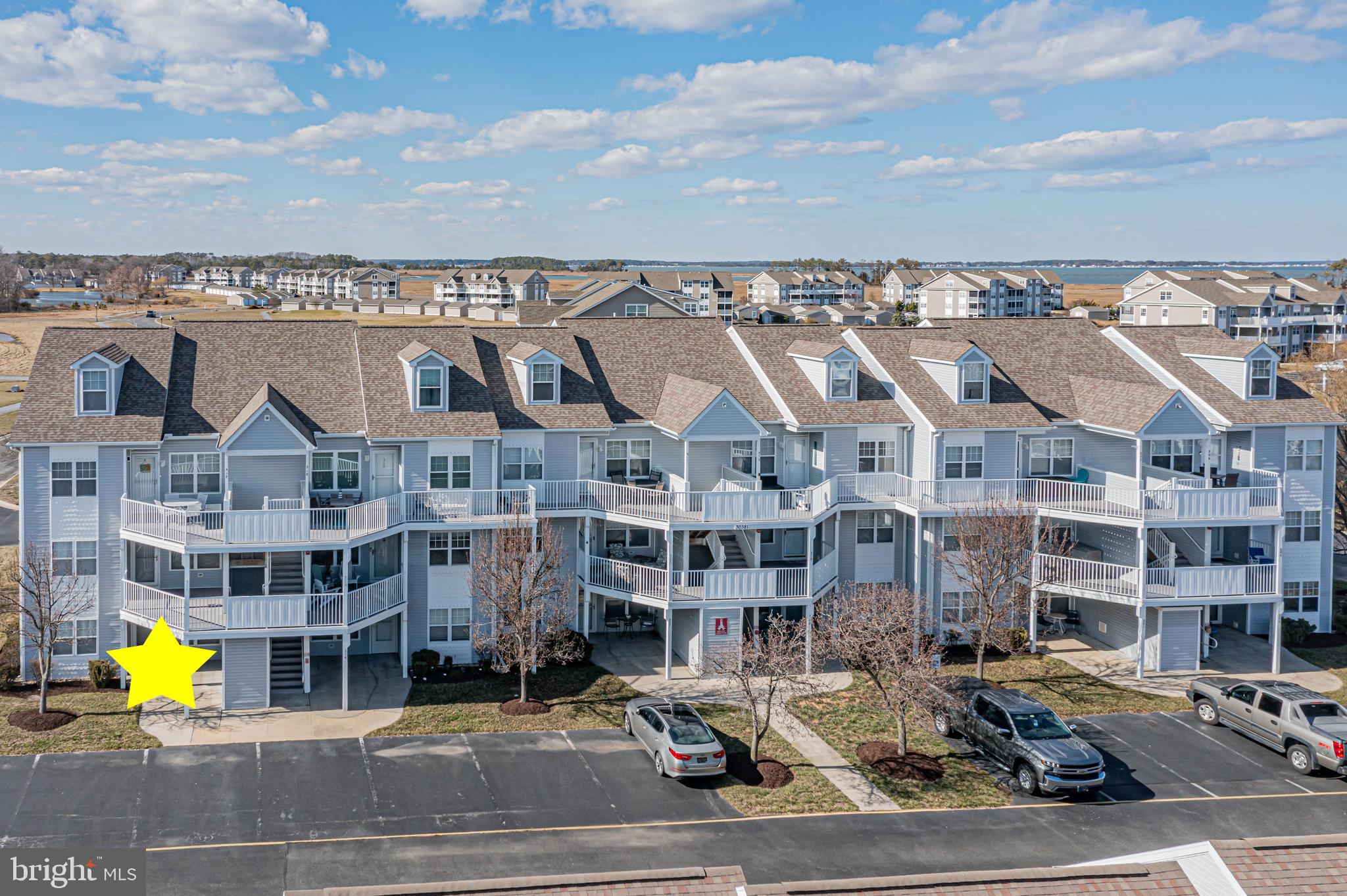 30381 Crowley Drive, Unit 313 Ocean View, DE 19970 - Photo 3 of 47 a car parked in front of a building