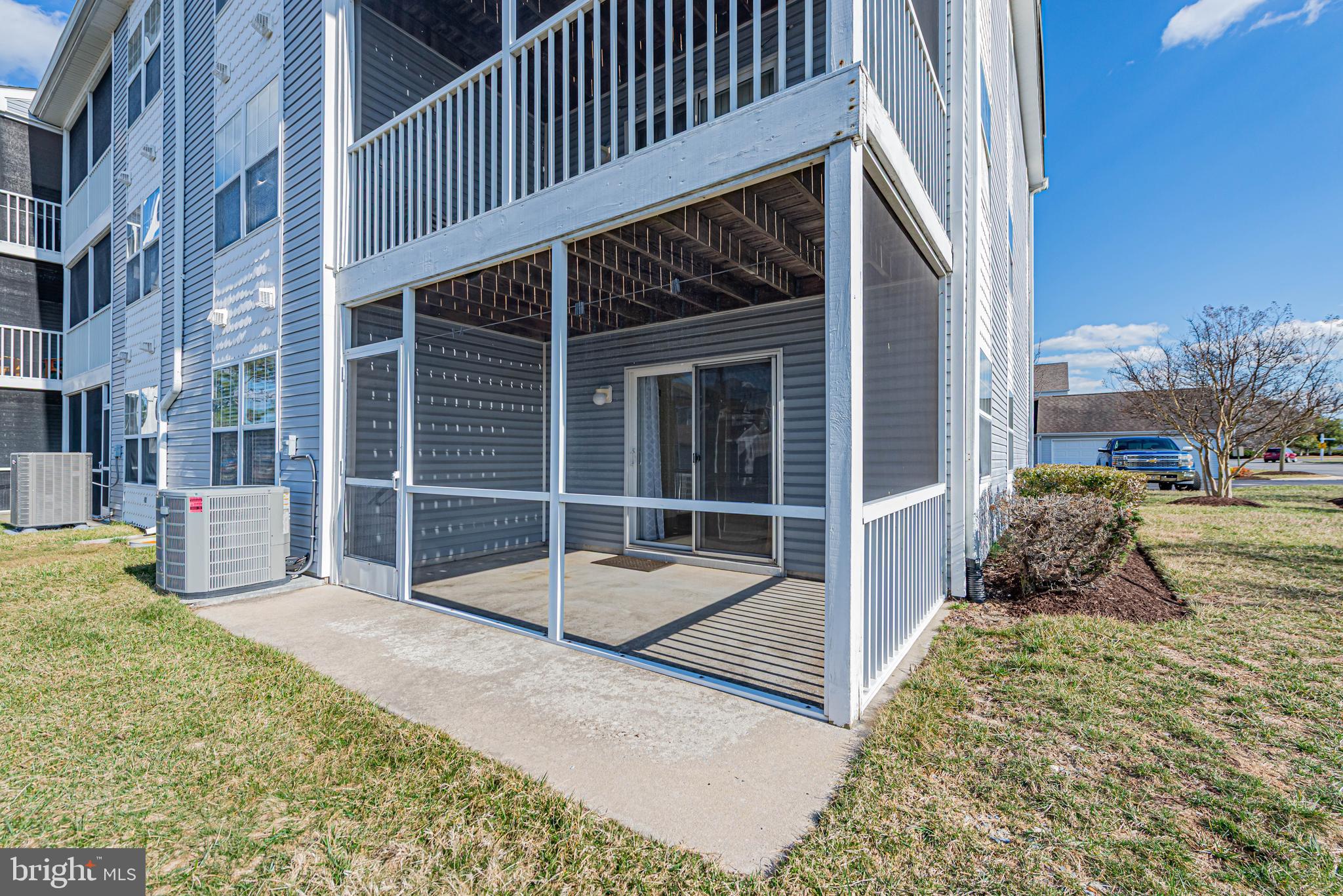 30381 Crowley Drive, Unit 313 Ocean View, DE 19970 - Photo 35 of 47 front view of a house with a yard