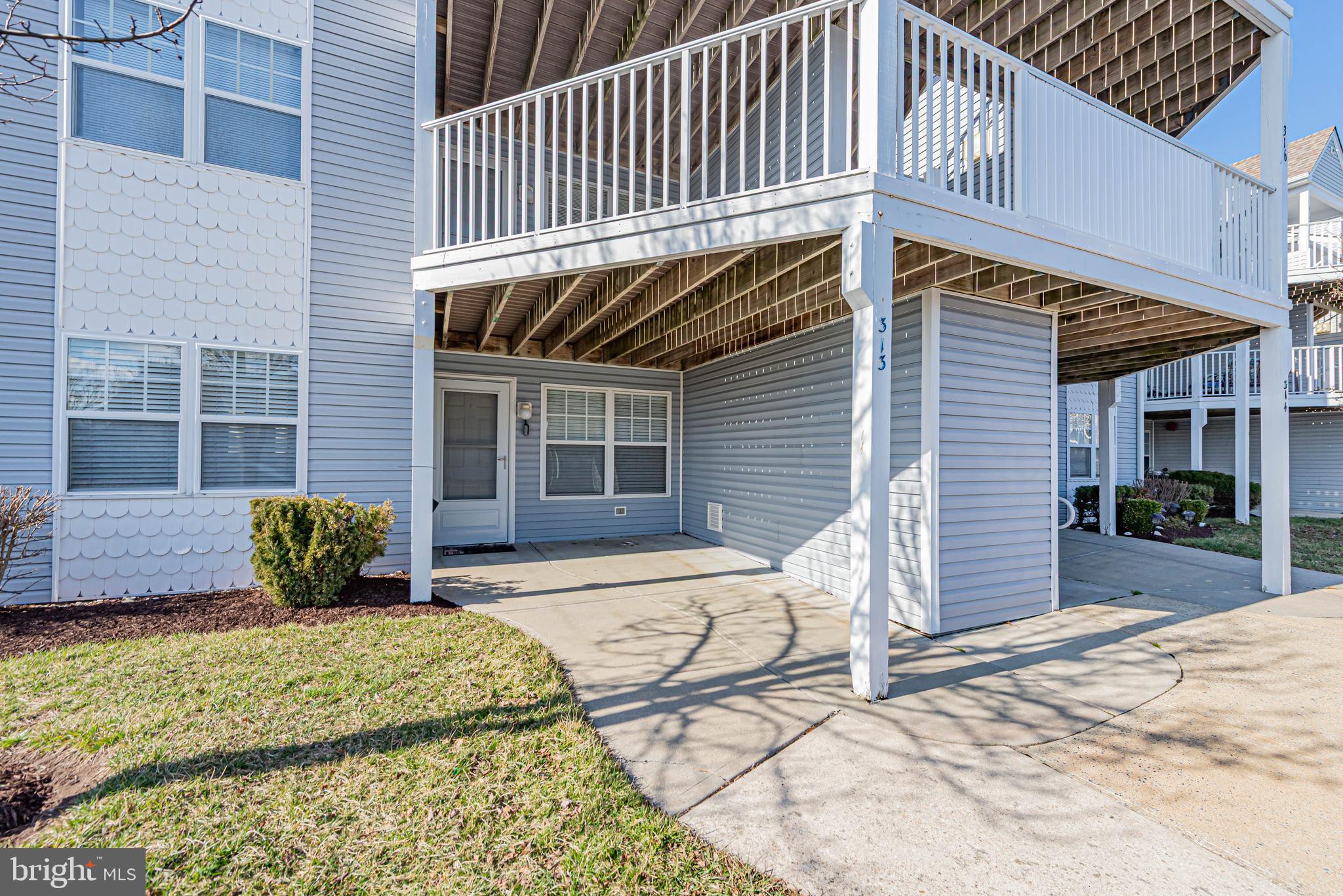 30381 Crowley Drive, Unit 313 Ocean View, DE 19970 - Photo 4 of 47 a view of a house with a patio