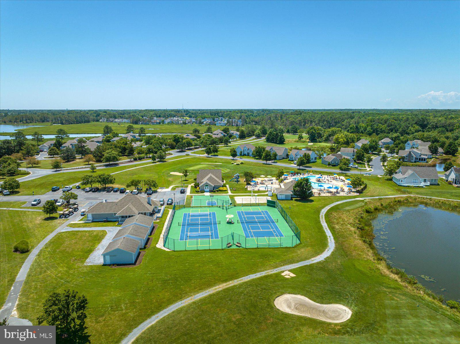 30381 Crowley Drive, Unit 313 Ocean View, DE 19970 - Photo 47 of 47 an aerial view of a house with a swimming pool