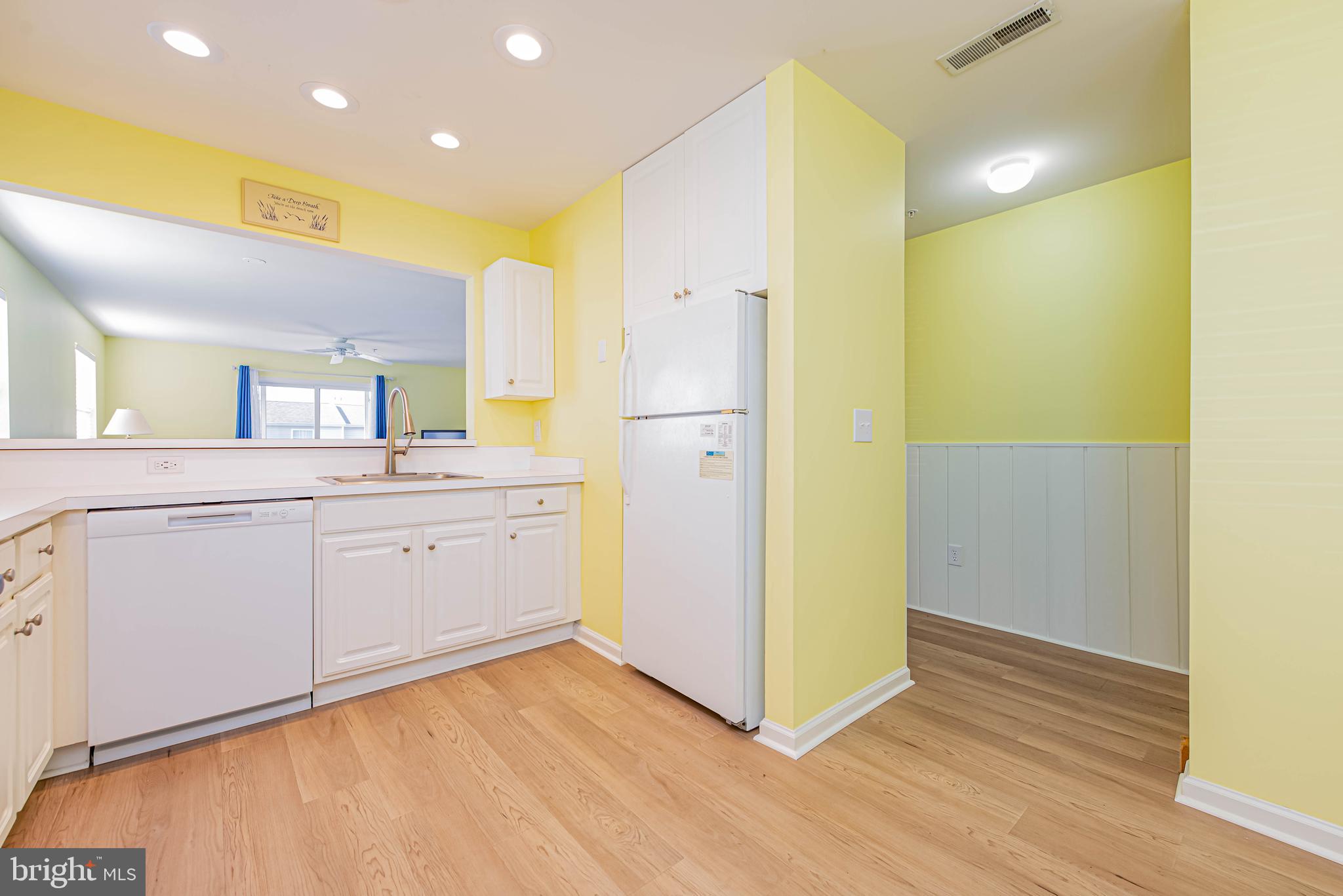 30381 Crowley Drive, Unit 313 Ocean View, DE 19970 - Photo 6 of 47 a view of a hallway with wooden floor