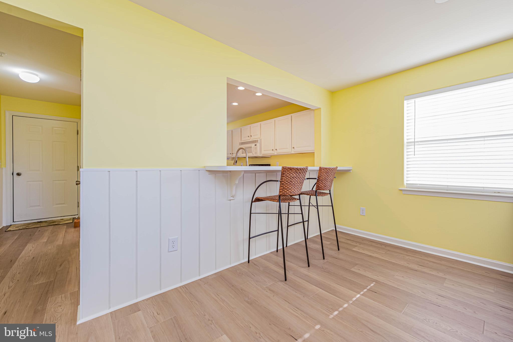 30381 Crowley Drive, Unit 313 Ocean View, DE 19970 - Photo 8 of 47 a view of a livingroom with furniture and wooden floor