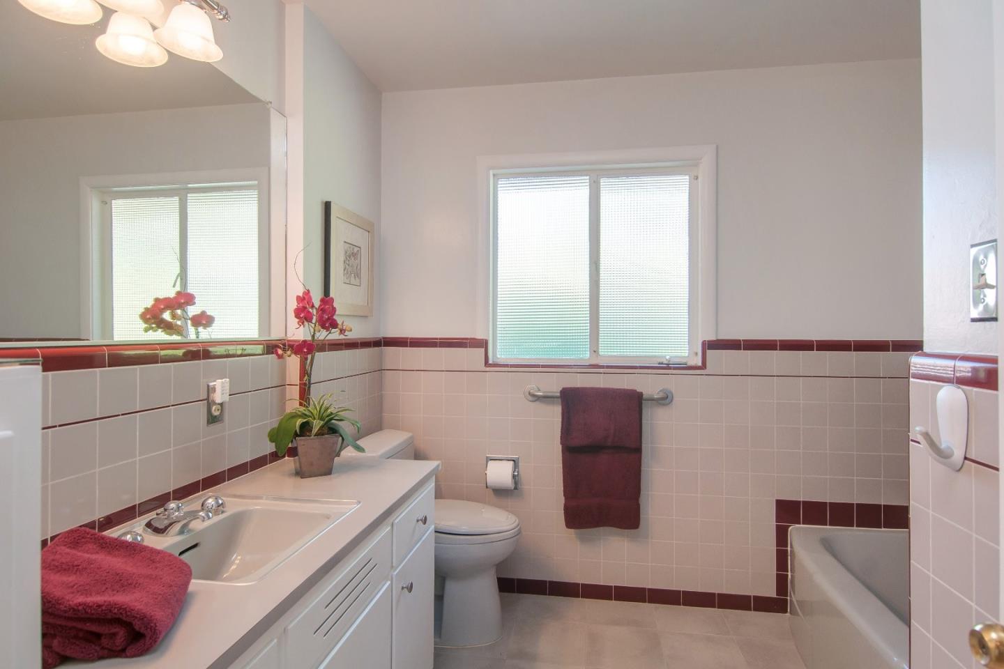 480 Darrell Road Hillsborough, CA 94010 - Photo 16 of 24 a bathroom with a sink toilet and mirror