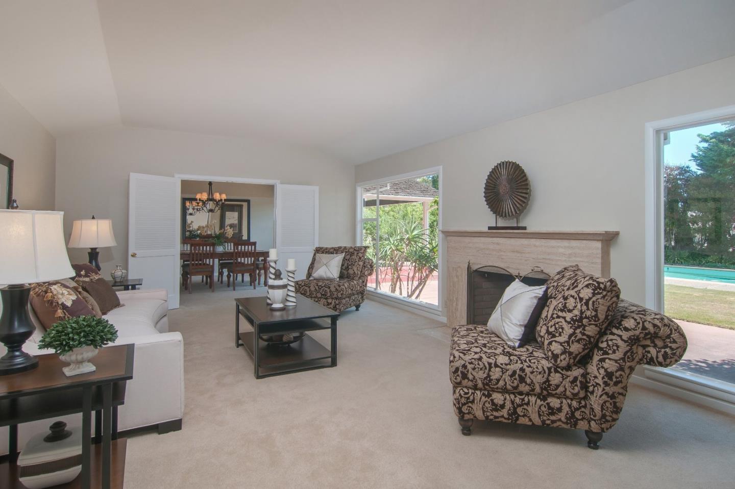 480 Darrell Road Hillsborough, CA 94010 - Photo 4 of 24 a living room with furniture and a fireplace