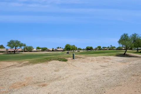 a view of a golf course with a lake