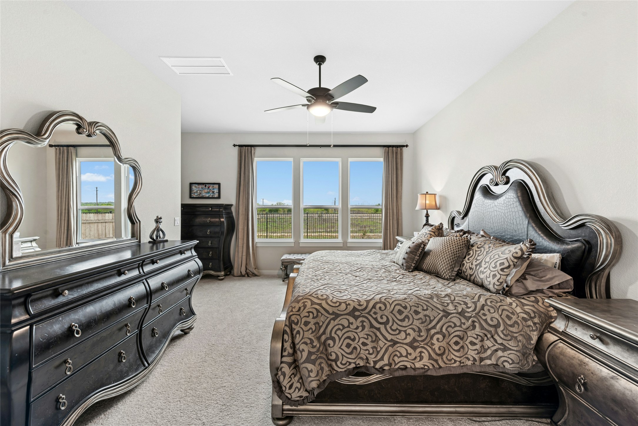 16213 Smithers Road Manor, TX 78653 - Photo 24 of 37 Bedroom featuring light carpet and a ceiling fan