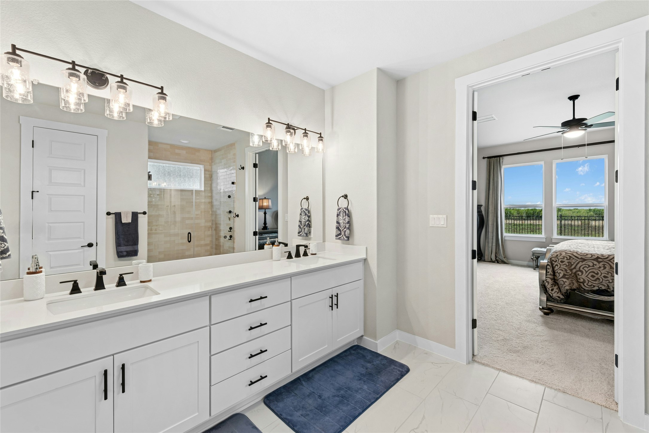 16213 Smithers Road Manor, TX 78653 - Photo 25 of 37 Full bath featuring double vanity, ensuite bath, with upgraded shower