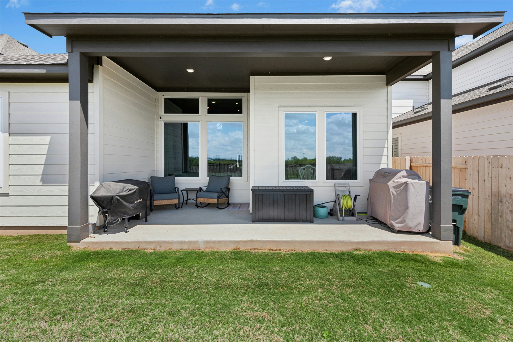 16213 Smithers Road Manor, TX 78653 - Photo 34 of 37 Back of house with a patio area