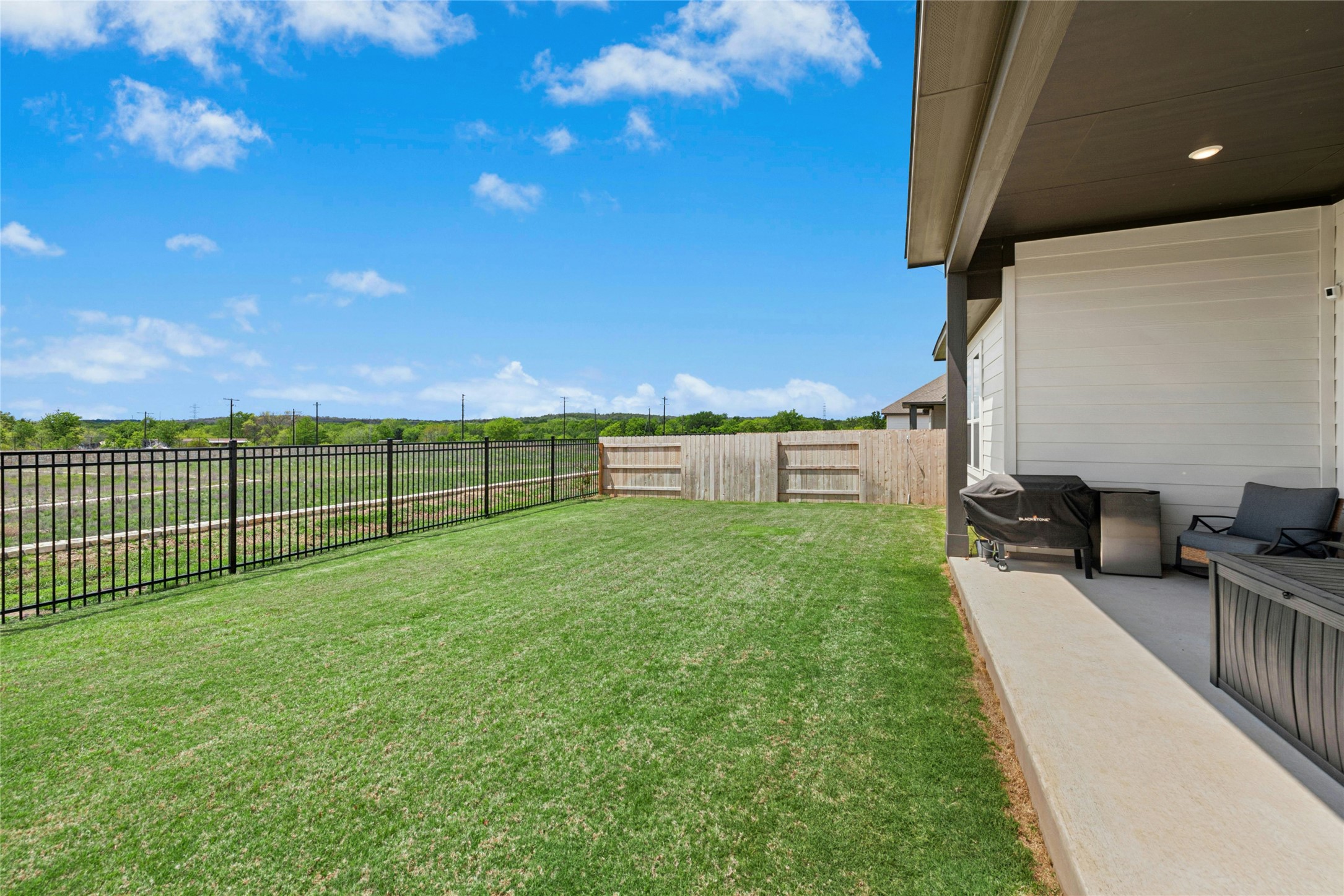 16213 Smithers Road Manor, TX 78653 - Photo 35 of 37 Large Fenced backyard featuring a patio