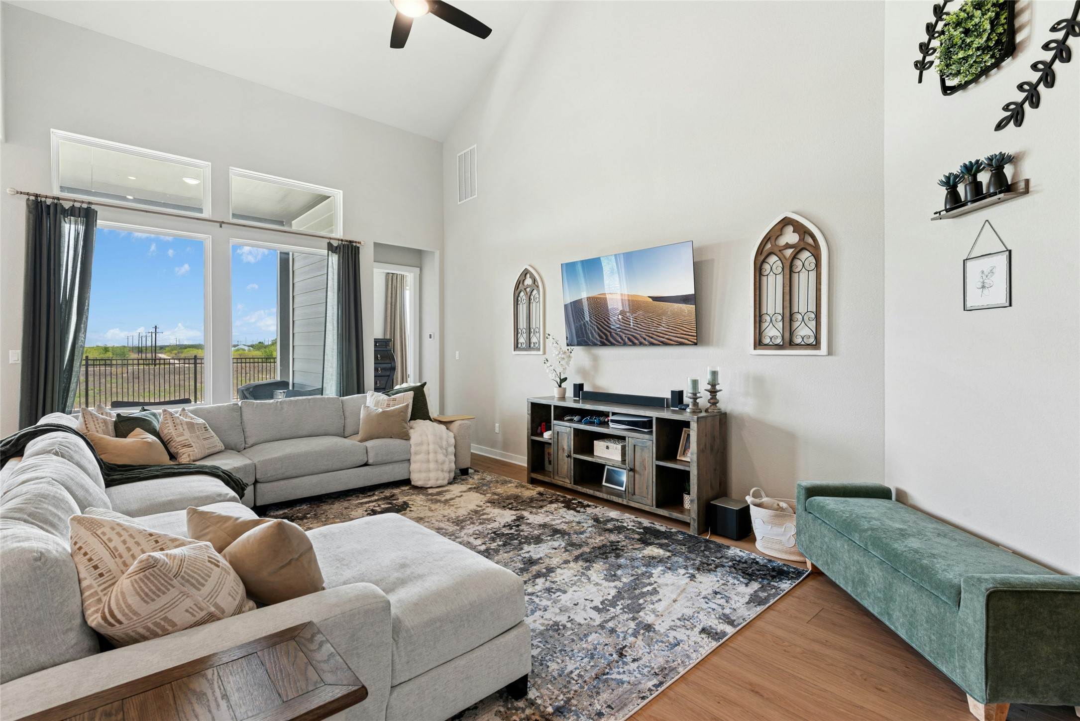16213 Smithers Road Manor, TX 78653 - Photo 8 of 37 Living room with wood finished floors, lofted ceiling, and ceiling fan