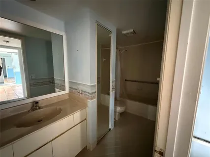 a bathroom with a sink and a large mirror