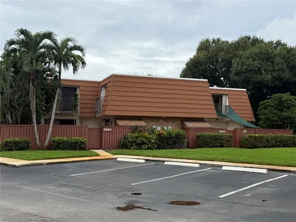 a front view of a house with garage