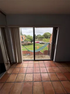 a view of a black and white floor and a floor to ceiling window