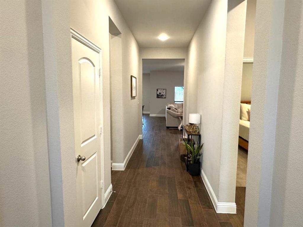 1455 Radecke Road Krum, TX 76249 - Photo 2 of 18 a view of a bathroom from the hallway