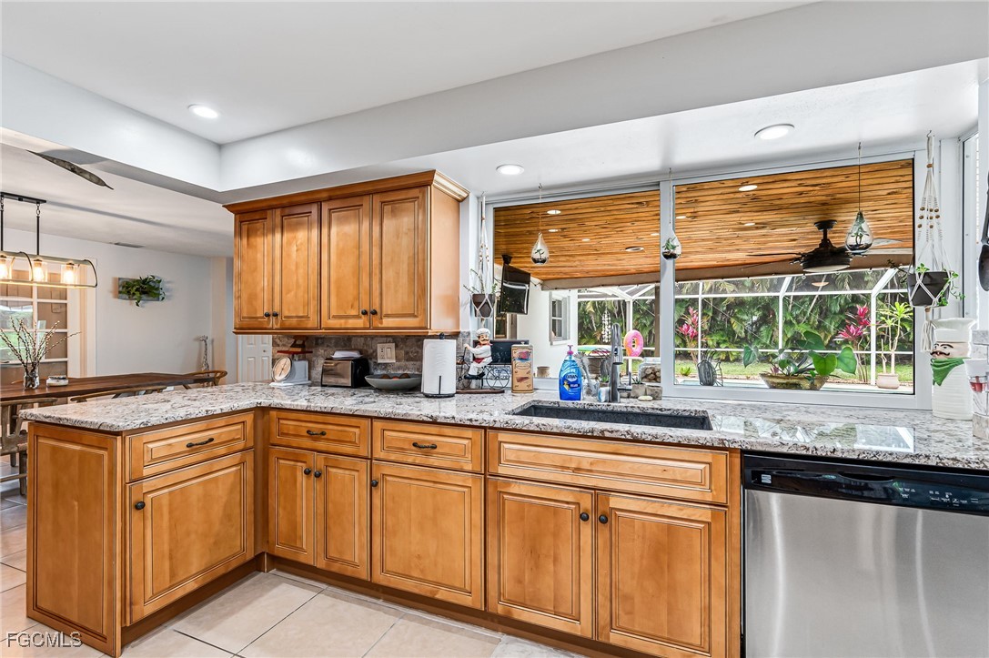 6519 East Town And River Road Fort Myers, FL 33919 - Photo 15 of 36 a kitchen with sink cabinets and large window