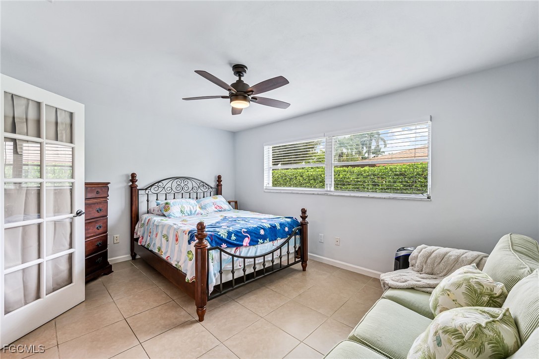 6519 East Town And River Road Fort Myers, FL 33919 - Photo 20 of 36 a bed room with a bed and a window