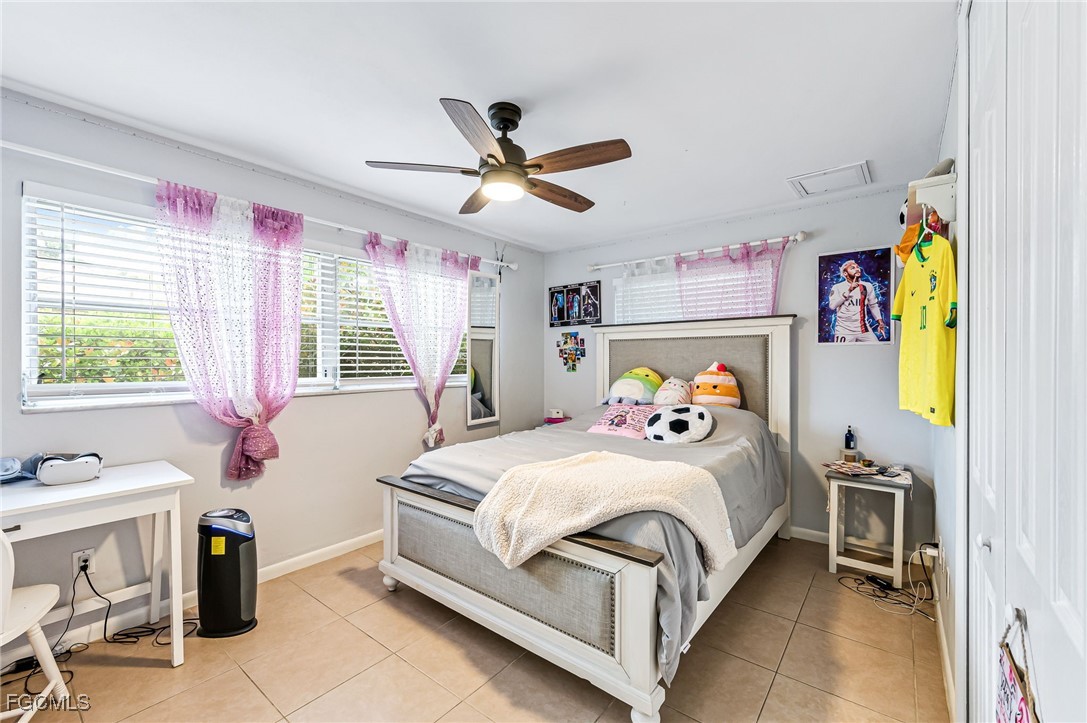 6519 East Town And River Road Fort Myers, FL 33919 - Photo 23 of 36 a bedroom with a bed and a window