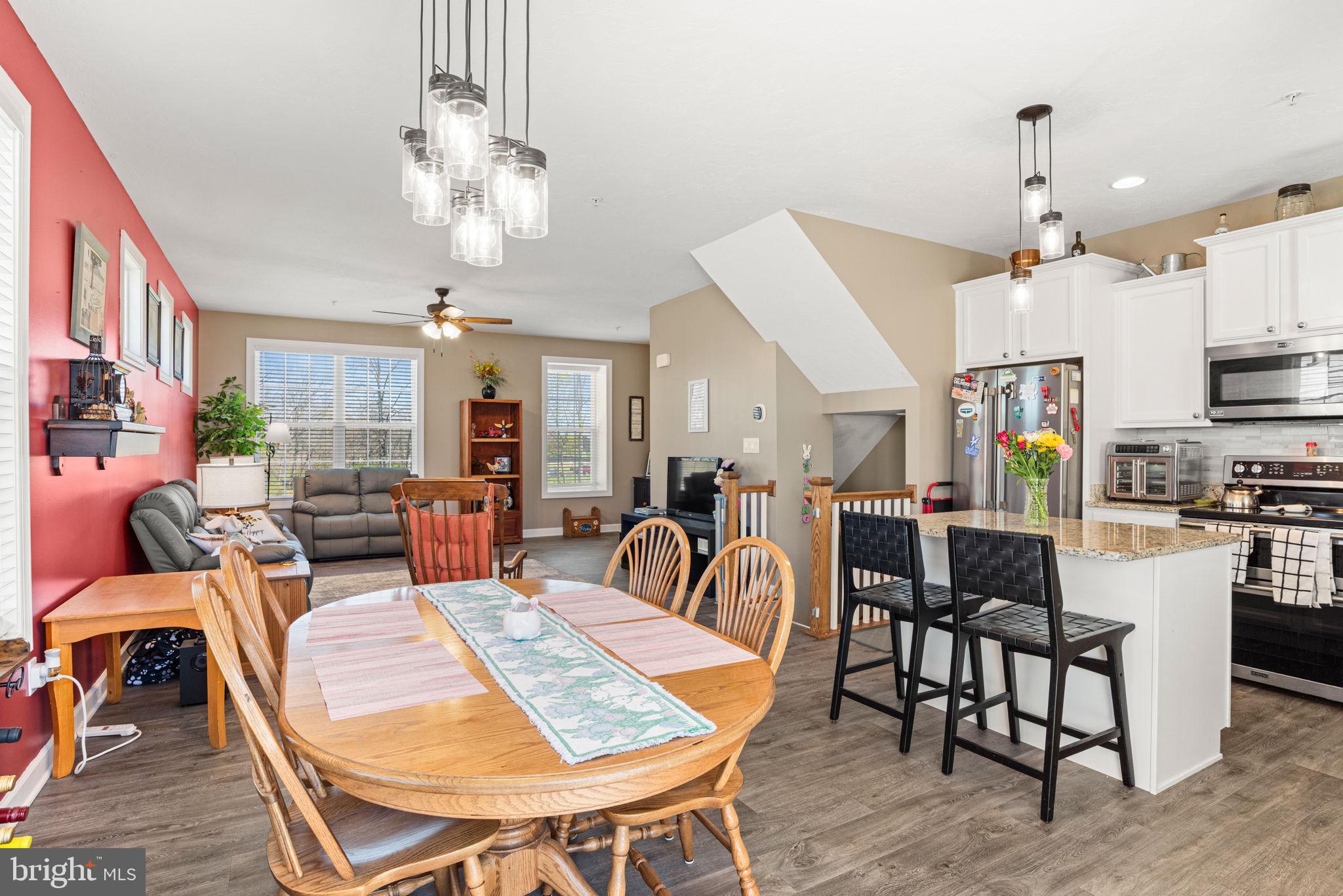 144 Overlook Dr. Hanover, PA 17331 - Photo 14 of 35 a view of a dining room with furniture a chandelier and wooden floor