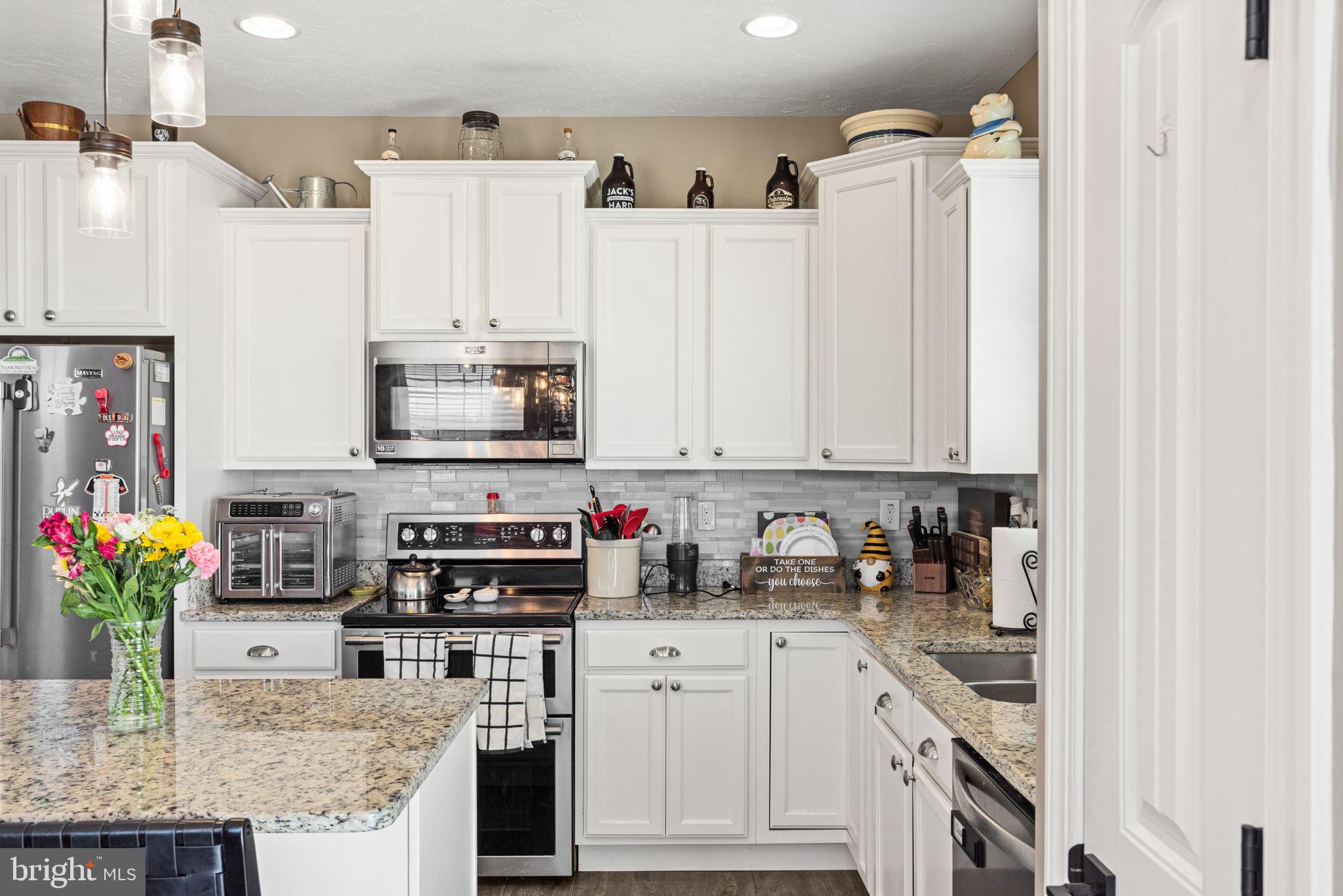 144 Overlook Dr. Hanover, PA 17331 - Photo 15 of 35 a kitchen with stainless steel appliances granite countertop a refrigerator sink and cabinets