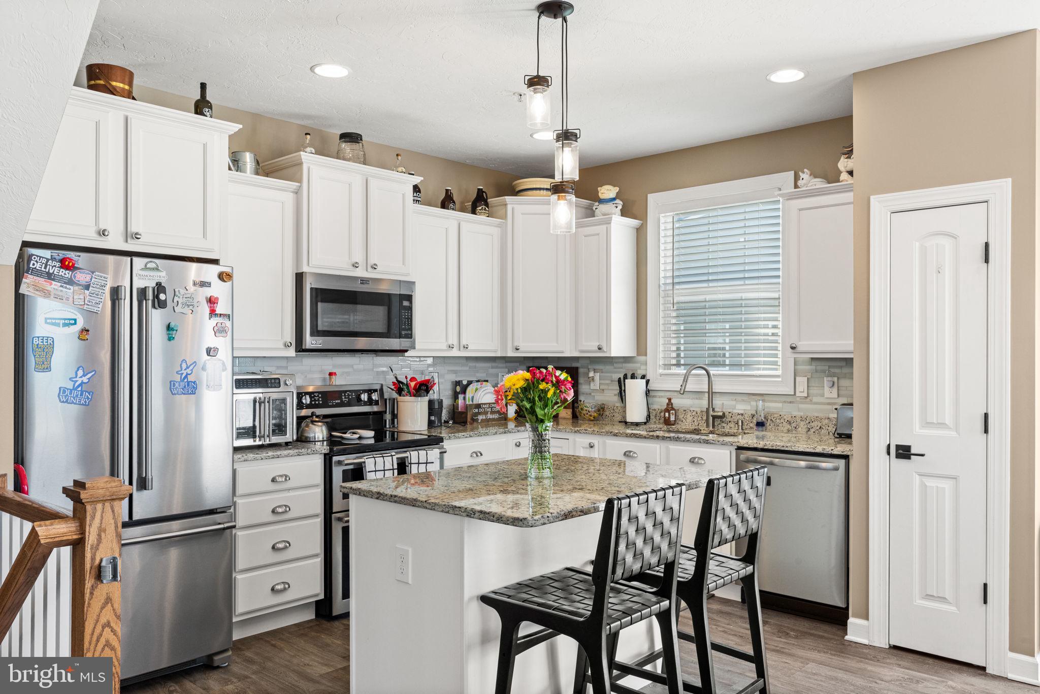 144 Overlook Dr. Hanover, PA 17331 - Photo 18 of 35 a kitchen with white cabinets and stainless steel appliances
