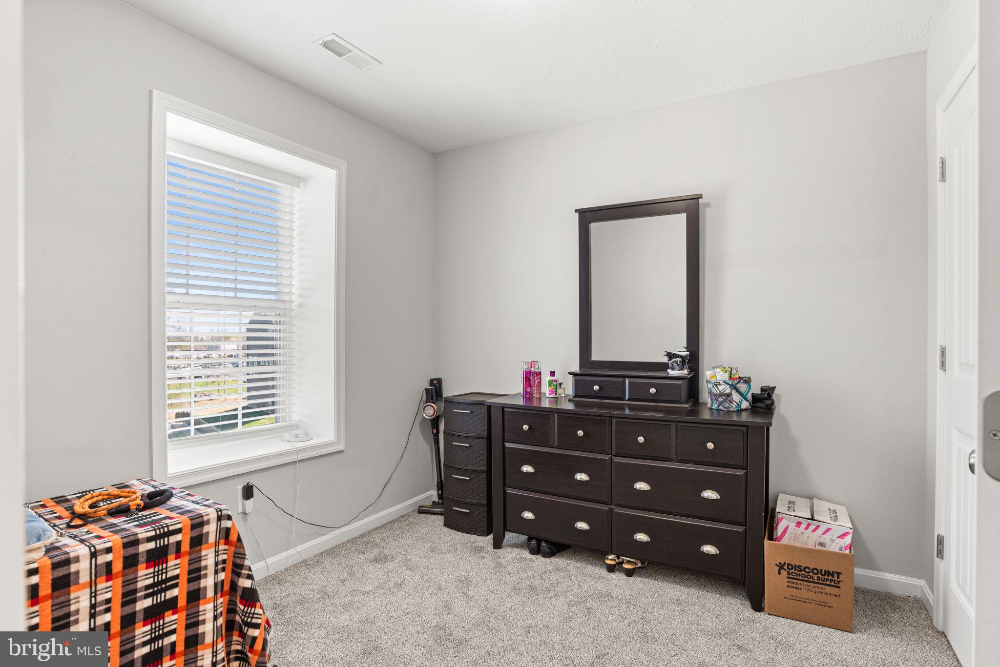 144 Overlook Dr. Hanover, PA 17331 - Photo 19 of 35 a bedroom with a dresser and a window