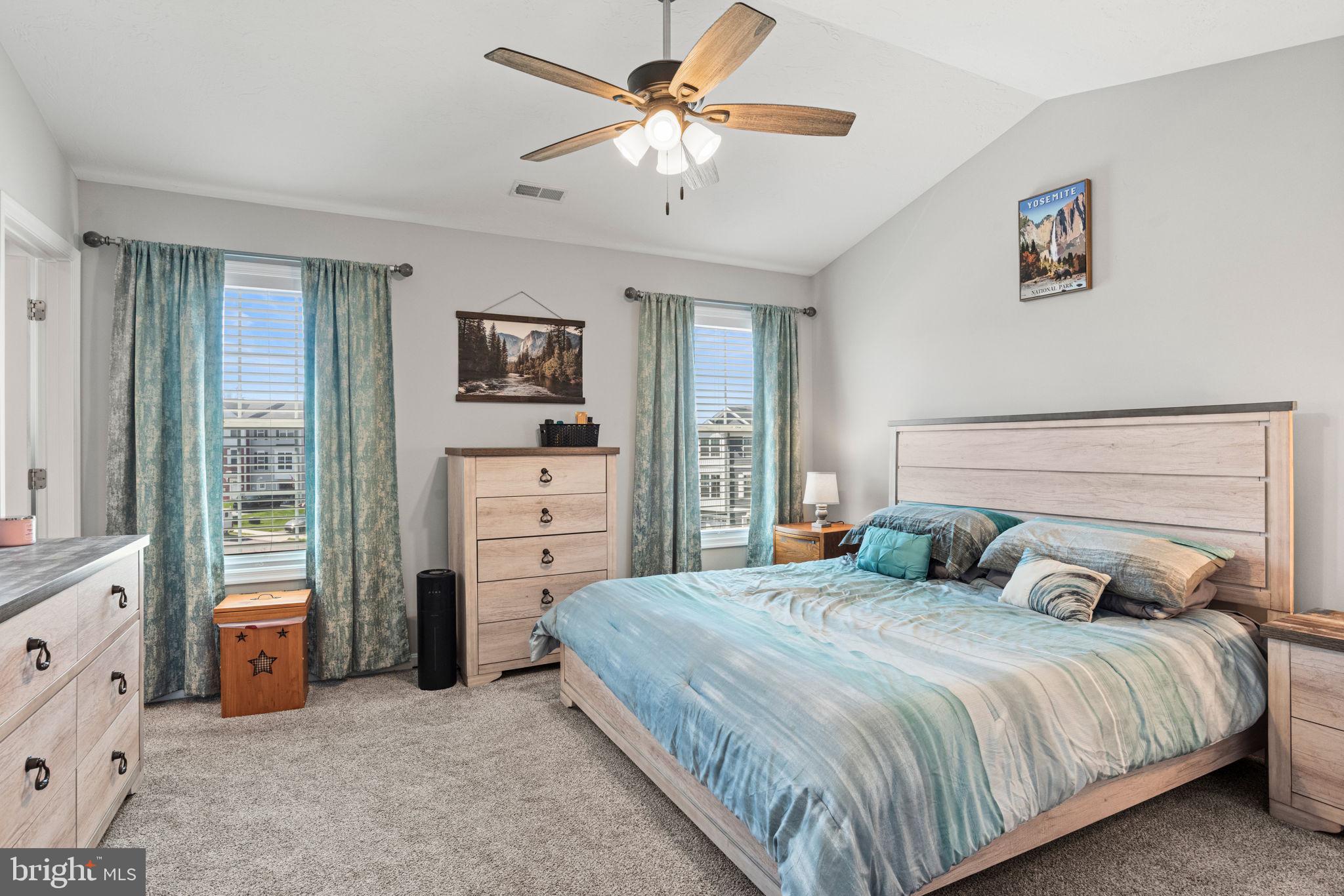 144 Overlook Dr. Hanover, PA 17331 - Photo 29 of 35 a bedroom with a bed and a chandelier