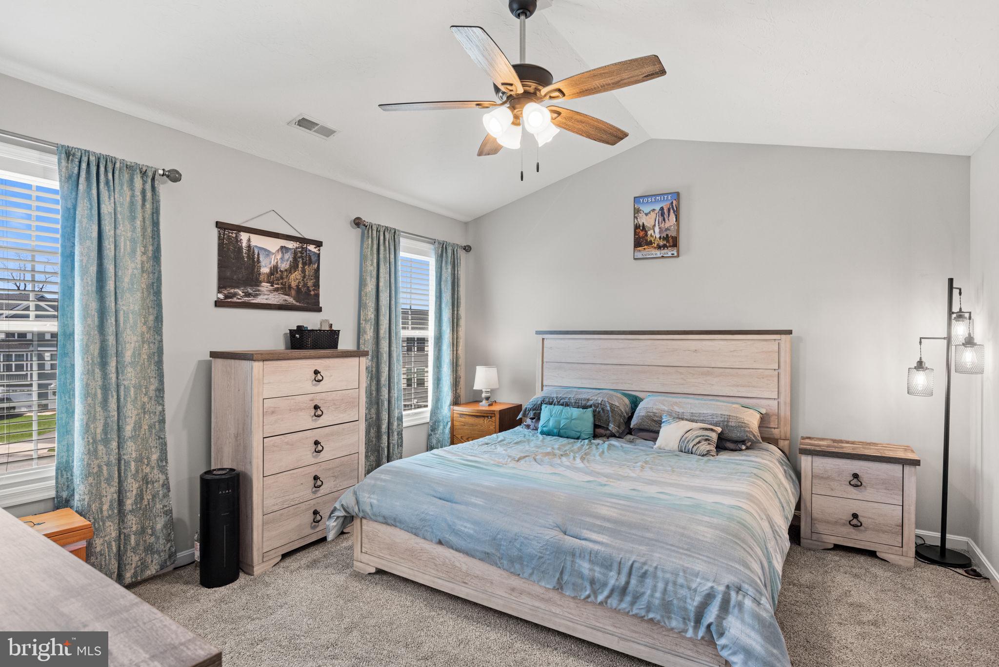 144 Overlook Dr. Hanover, PA 17331 - Photo 30 of 35 a bedroom with a bed and a chandelier