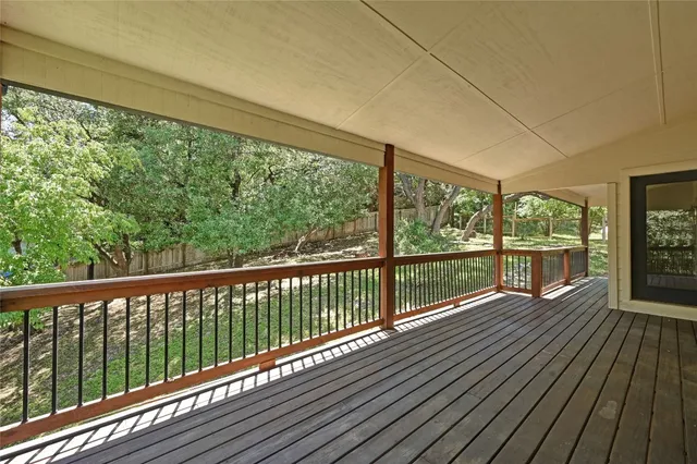 a view of balcony with wooden floor