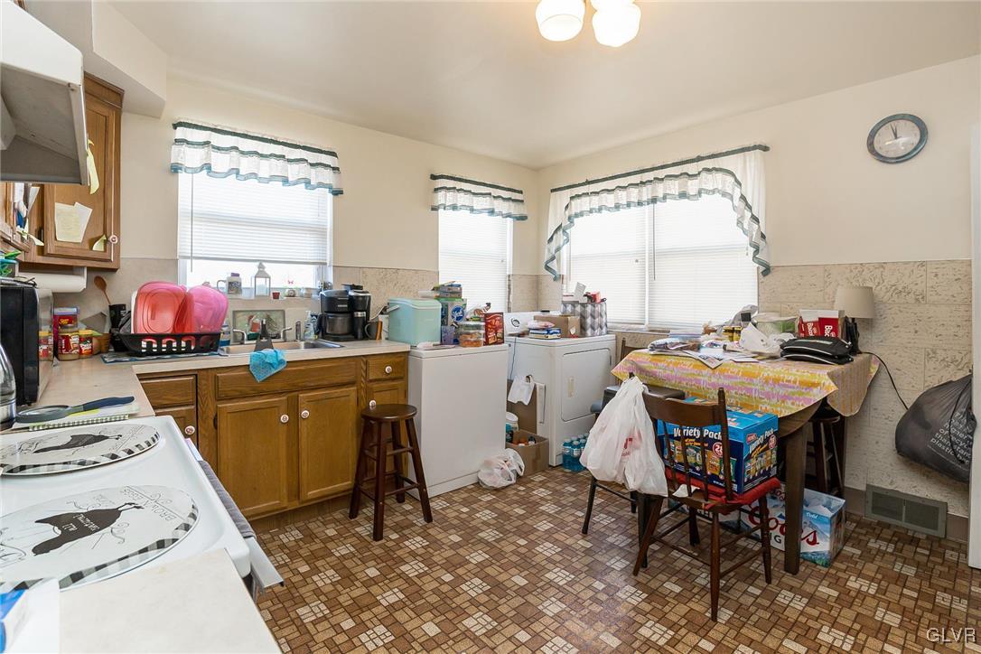 802 Spring Street Bethlehem, PA 18018 - Photo 7 of 14 a kitchen that has a table and chair in it