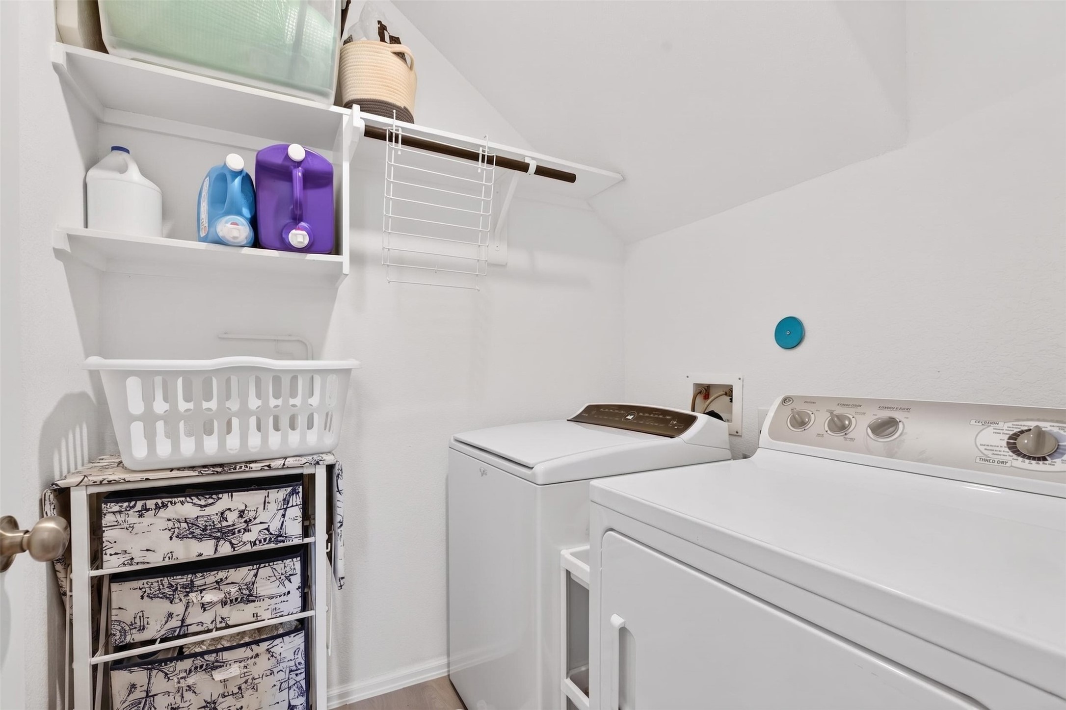 2832 Mistygate Court Conroe, TX 77301 - Photo 31 of 50 Laundry room with washer and dryer area, shelving, and storage space.