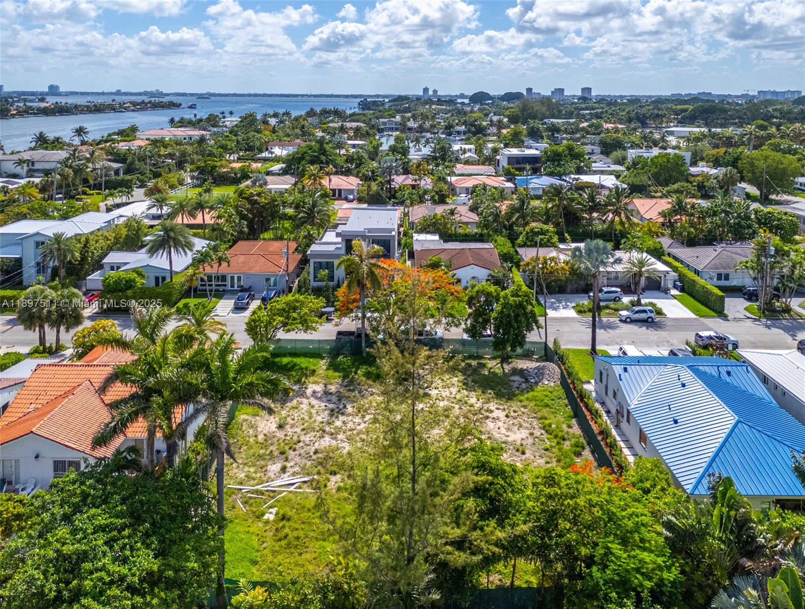 8835 Froude Avenue Surfside, FL 33154 - Photo 7 of 13 an aerial view of residential houses with outdoor space and trees