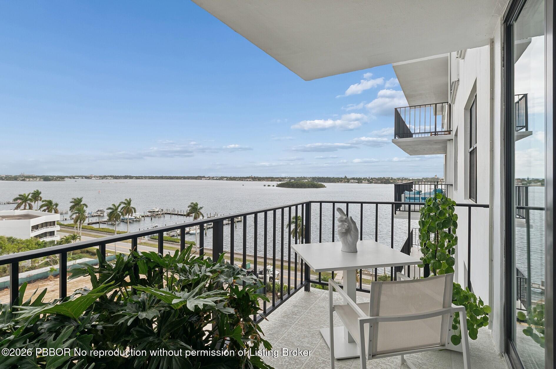 3800 Washington Road, Unit 909 West Palm Beach, FL 33405 - Photo 1 of 9 a view of a balcony with chairs