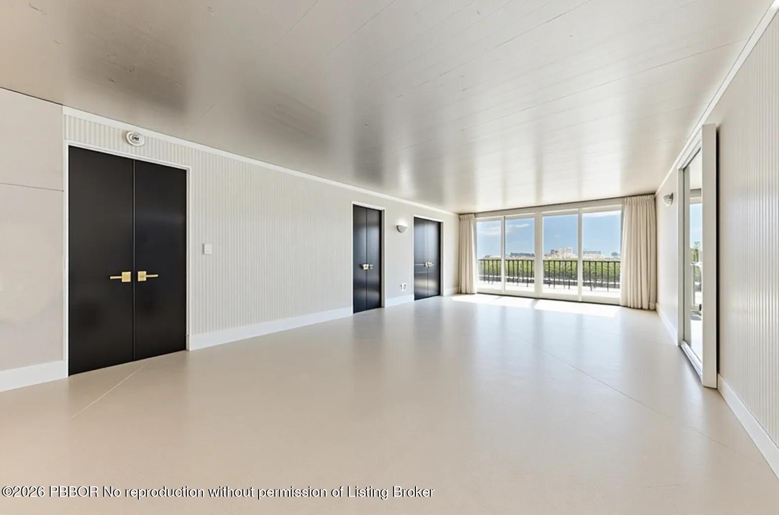 3800 Washington Road, Unit 909 West Palm Beach, FL 33405 - Photo 2 of 9 a view of an empty room with a window