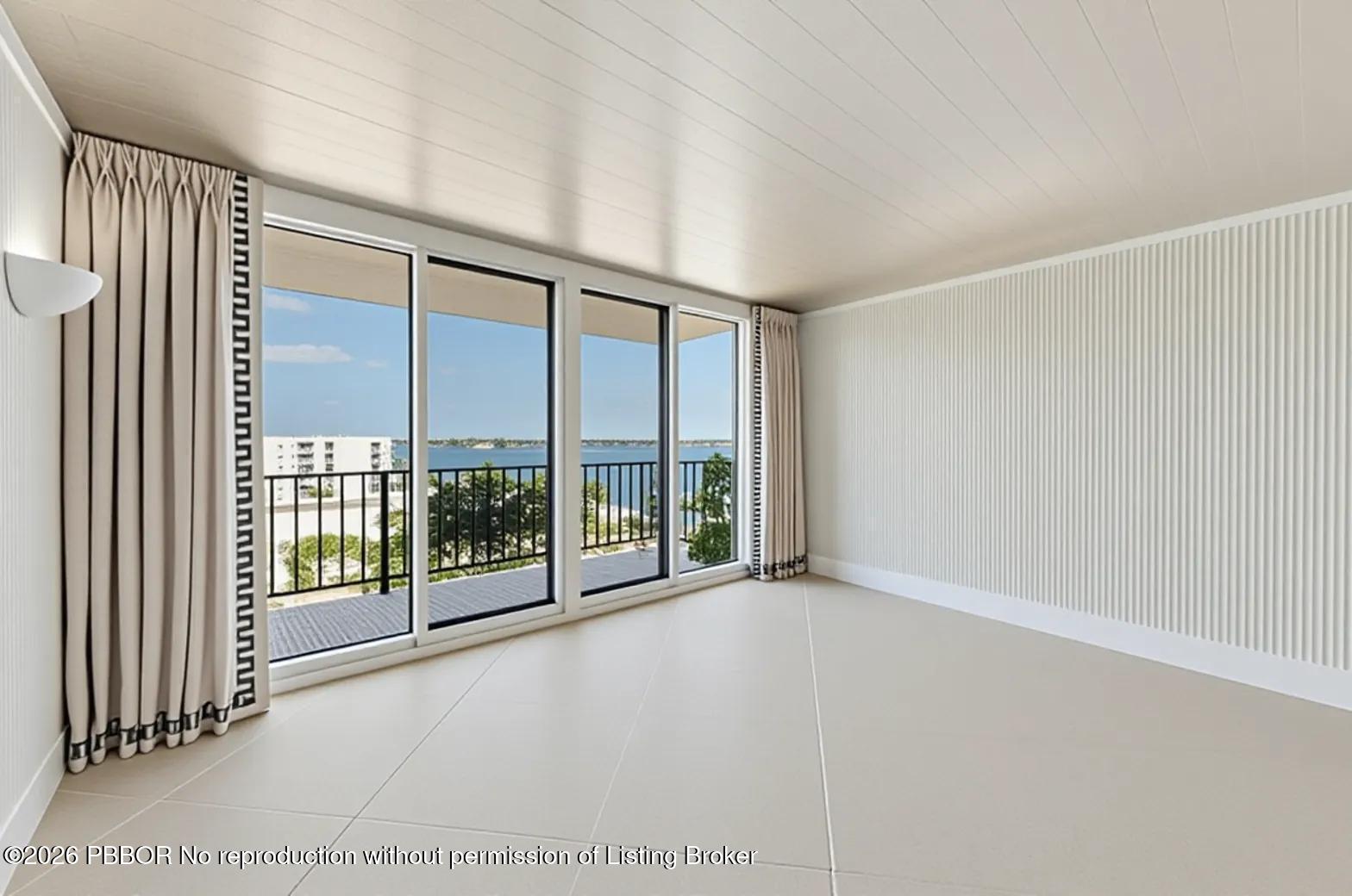 3800 Washington Road, Unit 909 West Palm Beach, FL 33405 - Photo 7 of 9 a view of an empty room with windows