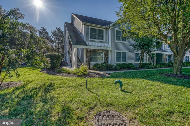 a house view with swimming pool and garden