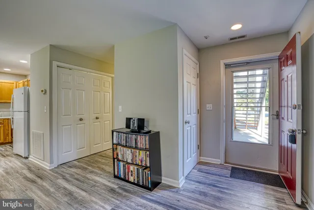 a view of livingroom with furniture wooden floor and windows