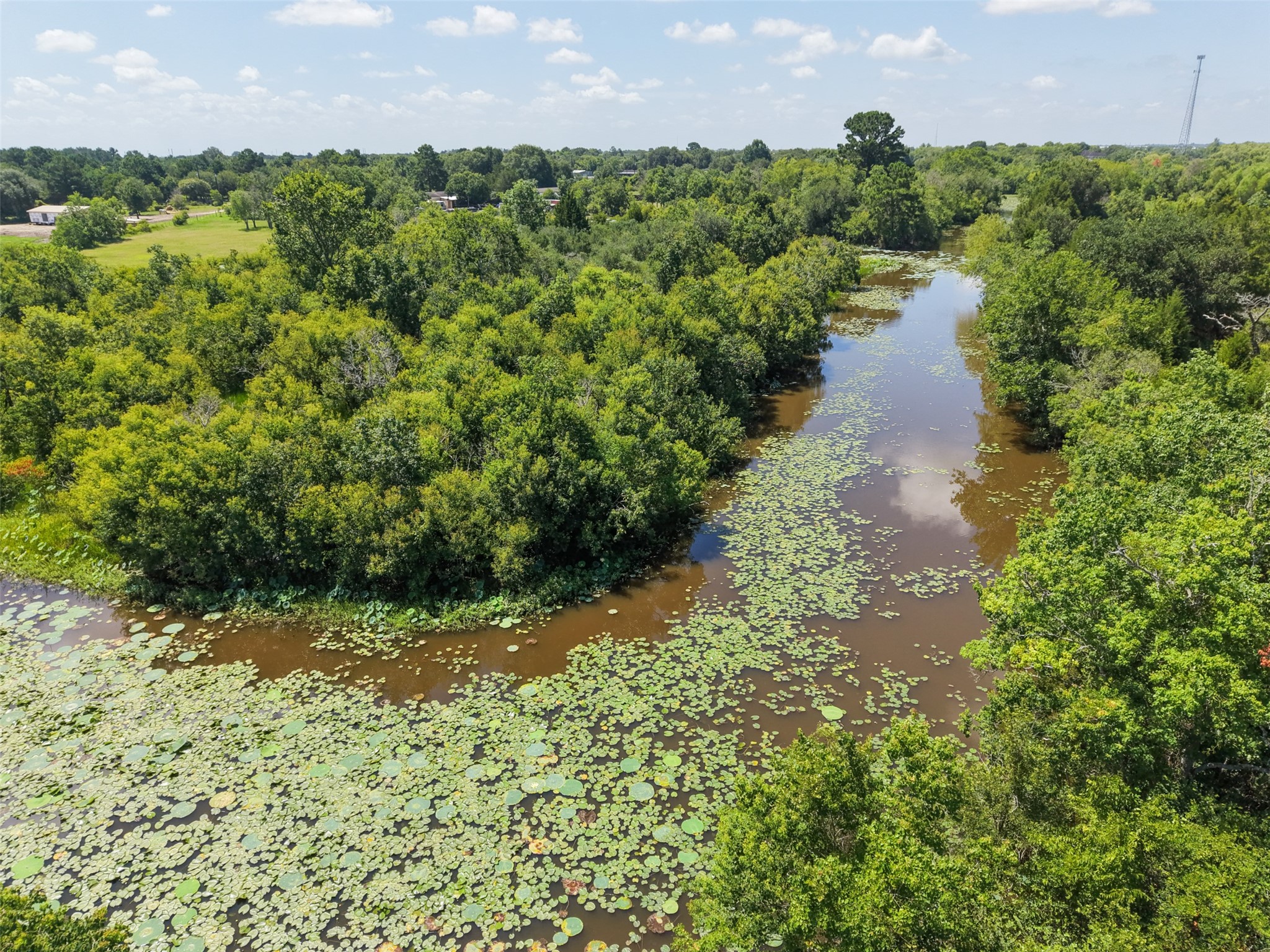 28619 Barry Lane Waller, TX 77484 - Photo 26 of 28 Scenic creek winding through the property adds natural beauty, attracts wildlife, and enhances the tranquil setting