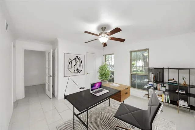 a living room with furniture a rug and a window