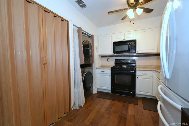 a kitchen with a refrigerator stove and a sink