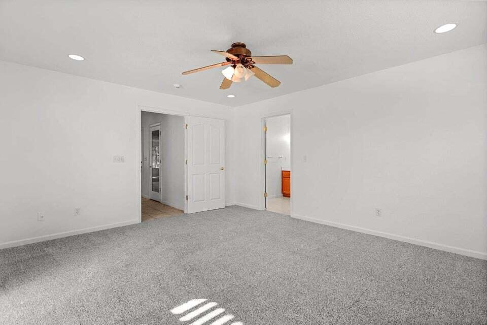 16840 Hawthorne Avenue Anderson, CA 96007 - Photo 15 of 37 an empty room with a ceiling fan and window
