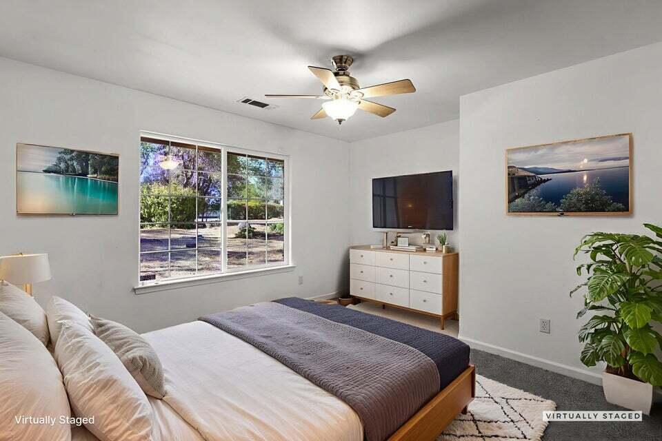 16840 Hawthorne Avenue Anderson, CA 96007 - Photo 20 of 37 a bedroom with a bed and a flat screen tv