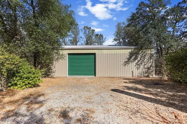 a view of backyard of a house