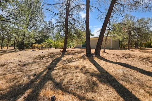 a view of a backyard of the house