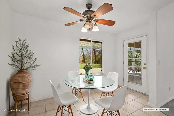a view of a dining room with furniture window and outside view