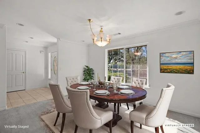 a view of a dining room with furniture window and outside view